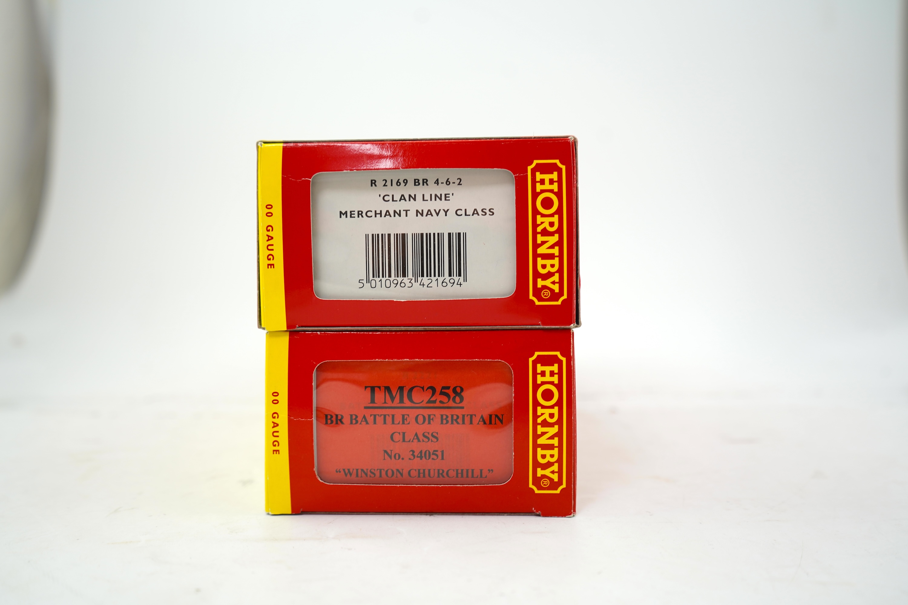 Two boxed Hornby Hobbies 00 gauge railway BR tender locomotives; a Merchant Navy Class, Clan Line 35028, (R2169), together with a Battle of Britain Class, Winston Churchill 34051, (TMC258)